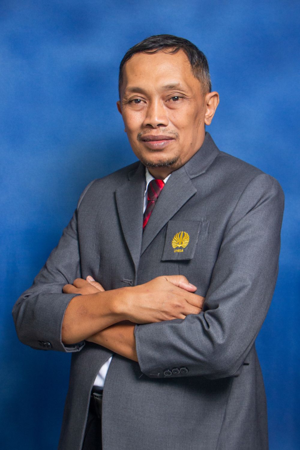 Dr. Amrozi Khamidi, S.Pd., M.Pd.